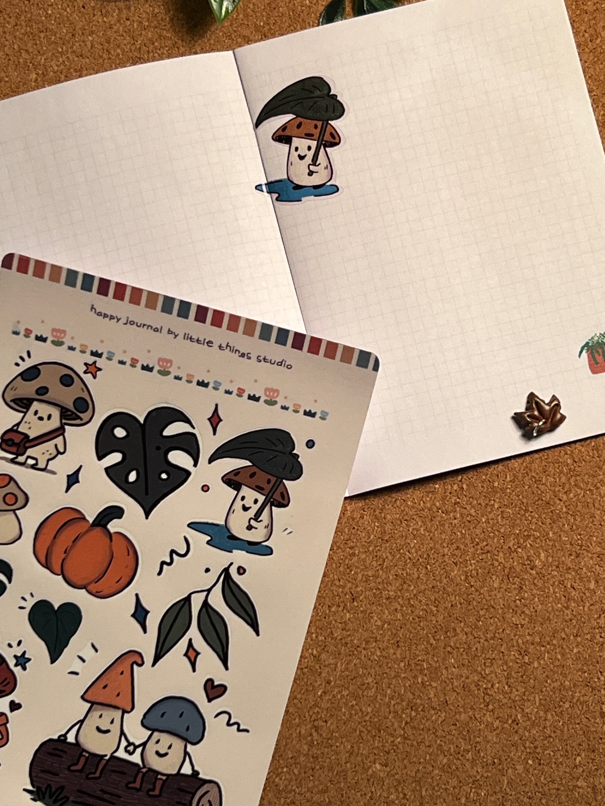 Set of Halloween-themed stickers on a cork board